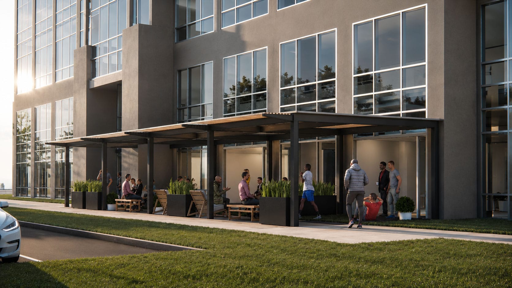 Shaded outdoor seating under a steel pergola with planters at the Five Coliseum Centre office building in Charlotte, NC, designed by Ossa Studio