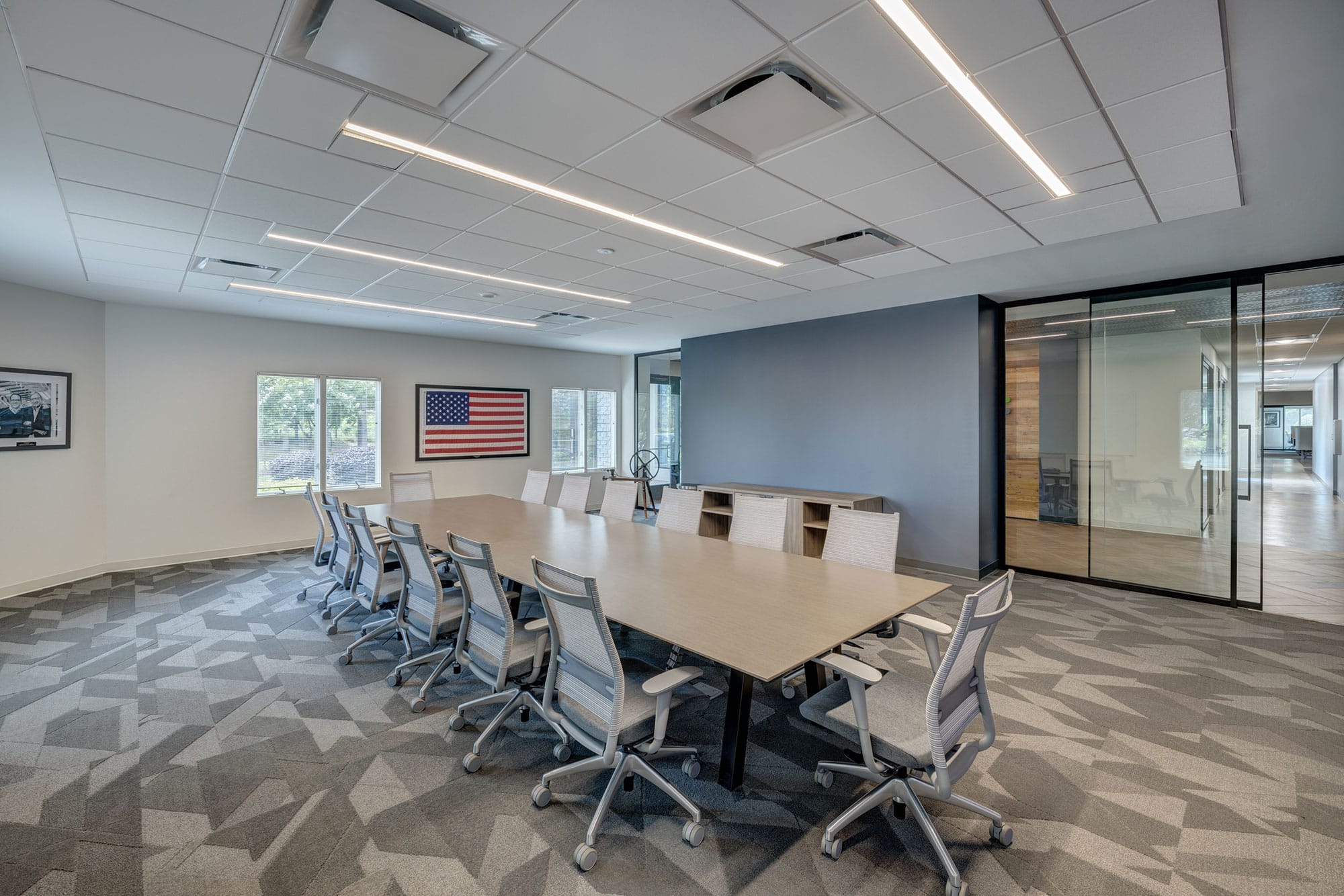 Conference room with glass partitions in the B&W Fiberglass office in Shelby, NC, designed by Ossa Studio