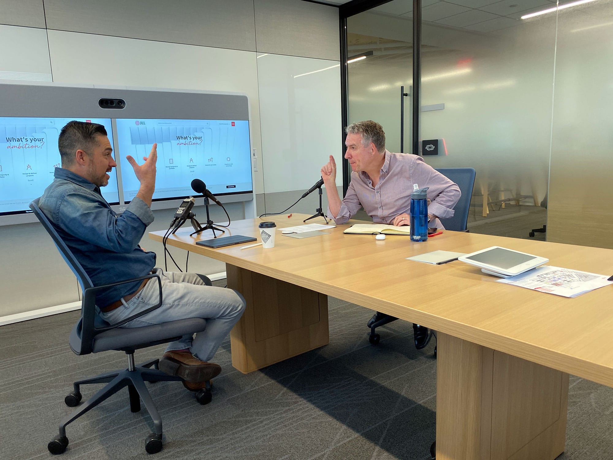 Jack Ossa recording an episode of The Power of Design Podcast with a guest